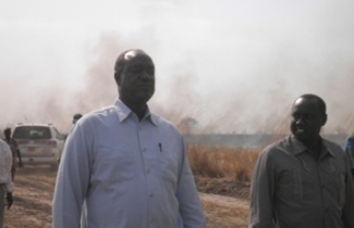 Jonglei governor Kuol Manyang (L) and Physical infrastructure Minister, Manawe Peter (R) on Gadiang-Akobo road on March 3,2011 (ST)