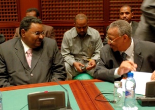Sudan’s Security Presidential Adviser Salah Gosh (L), and Presidential Assistant Nafi Ali Nafi (R) during peace talks with Darfur rebels in the Libyan town of Sirte in 2007 (UNMIS)