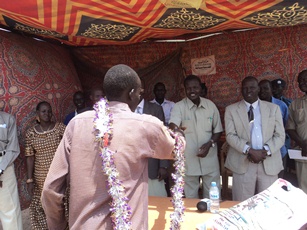 State minister of education, Them Kuol Machar, with pupils during ceremony in Bentiu town March 13, 2011 (ST)