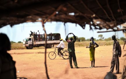 Villagers living in a small village in the northern part of Unity State in Southern Sudan stand next the only road connecting their village on November 11, 2010 (Getty)