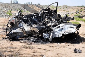 The wreckage of a car is seen following a missile attack near Port Sudan April 6, 2011 (Reuters)