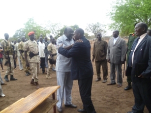 The governors of Lakes and W. Equatoria hugging upon arrival at the peace meeting in Mopourdit, South Sudan (ST)