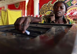 A South Sudanese woman casts her vote at a polling station during the referendum in Kadugli, capital of South Kordofan, in the border between South and North Sudan January 9, 2011 (Reuters Pictures)