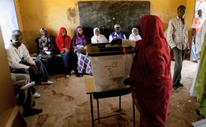 A Sudanese woman drops her vote into a ballot box during gubernatorial and legislative elections being held in Kadugli, in South Kordofan,  on May 2, 2011 (Getty)