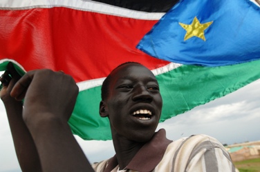 A Sudanese celebrate the decision of the Permanent Court of Arbitration on Abyei, central Sudan, July 22, 2009. (Photo Mckulka - UNMIS)