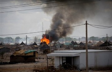 In this photo released by the United Nations Mission in Sudan (UNMIS), homes are seen burning in the town of Abyei, Sudan, Monday, May 23, 2011