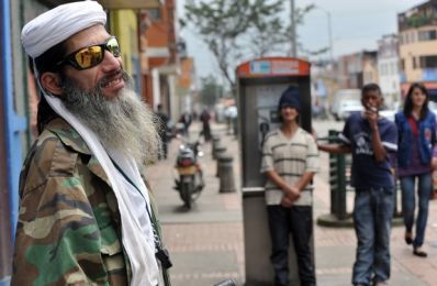 Colombian Hasmet Hichster Londono, an admirer of Al-Qaeda leader Osama bin Laden who has been personifying him for seven years, walks around the neigbourhood of Santa Fe in Bogota, Colombia, on May 4, 2011. (Getty)