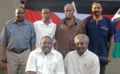 Abdel Wahild Al-Nur (L) SLM leader with Salah Abu Surra (R) and other members of the group stand behind after the signing of the reintegration agreement on 11 May 2011 (photo www.slmasecularsudan.com)