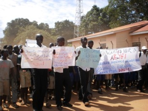 Protestors hold banners as they march through Yambio town - Western Equatoria state, South Sudan - against the occupation of Abyei by the northern army as the South approaches independence. May 23, 2011 (ST)