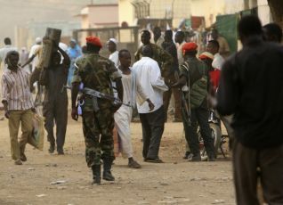 Sudan People's Liberation Movement (SPLM) military soldiers walk at Kadogli market town in South Kordofan State May 1, 2011. (Reuters Pictures)