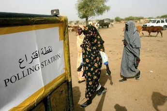 Sudanese women arrive at a polling station to vote in South Kordofan elections (AFP)
