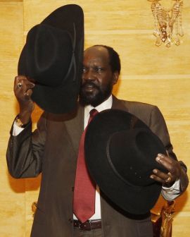 South Sudan's President Salva Kiir holds a hat he received from U.S. Senator John Kerry during their meeting in Juba January 8, 2011 (Reuters)