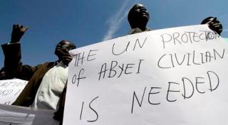 Members of Abyei civil society hold pro-southern independence placards during a protest outside the United Nations offices in Khartoum on September 23, 2010 (Getty)
