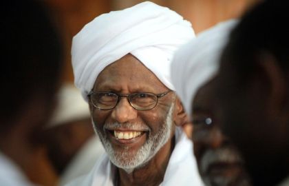 Hassan al-Turabi is welcomed by supporters in his home in Khartoum, on July 1, 2010 (Reuters)