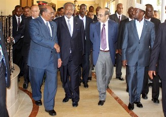 Sudan's President Omar Hassan al-Bashir (L) talks to Ethiopian Prime Minister Meles Zenawi (2nd R) and Somalia's President Sheikh Sharif (R) before the swearing-in ceremony of Djibouti's President Ismail Omar Guelleh (2nd L) in the capital Djibouti May 8, 2011 (Reuters)