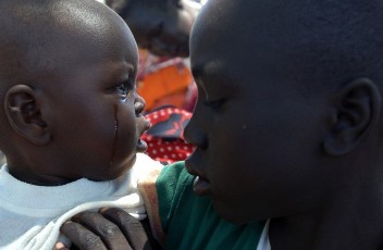 An internally displaced child from Abyei cries as he waits for food aid in Turalei May 27, 2011 (Reuters)
