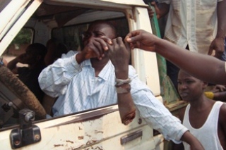 Arrow Boys display amputated hand of LRA fighter killed during Gangura clashes (ST)