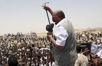 Sudan President Omar Hassan al-Bashir addresses supporters during a visit to Sinkat Town in Red Sea State June 19, 2011 (Reuters)