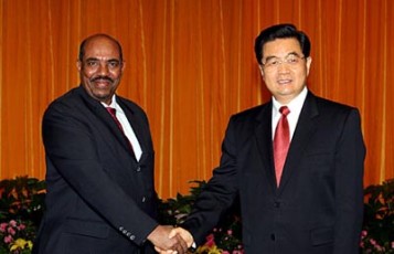 FILE - Chinese president Hu Jintao (R) shakes hand with Sudanese President Omer Hassan al-Bashir (Xinhua)