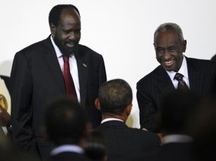 U.S. President Barack Obama (C) greets semi-autonomous South Sudan's President Salva Kiir (L) and Sudan's Vice President Ali Osman Taha (R), before a high level meeting on Sudan, at United Nations headquarters, in New York, September 24, 2010 (REUTERS PICTURES)