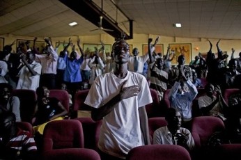 FILE - A southern Sudanese man stands and covers his heart during a rendition of southern Sudan's proposed national anthem during a selection contest in Juba on Sunday, 10 Oct. 2010 (AP)