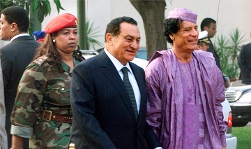 FILE - Libyan leader Muammar Al-Gaddafi (R) and Egyptian president Hosni Mubarak (L)