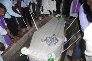 Coffin of Late Bishop Caesar Mazzolari lower to grave inside church in Rumbek. July 19, 2011 (ST)