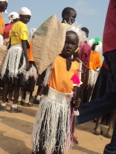 A small girl marching with a church group known as ‘Youth Mama’ displays a shield made of light wood during the South Sudan Independence Day celebration in Bor, 9 July 2011 (ST)