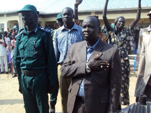 Payinjiar County Commisioner Peter Gai Joak touches his chest while singing the new national anthem of the independent Republic of South Sudan on Saturday. Unity State, Payinjiar. July 9, 2011 (ST)