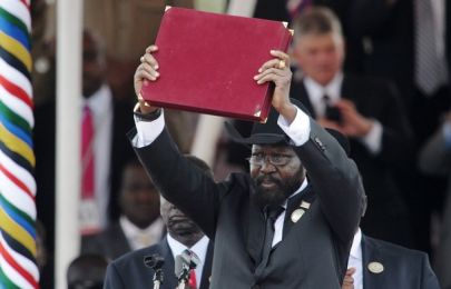 South Sudan's President Salva Kiir displays the transitional constitution of the Republic of South Sudan after signing it into law during the Independence Day celebrations in the capital Juba, July 9, 2011 (Getty)