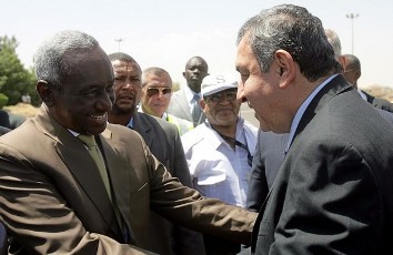 FILE - Sudan's Second Vice President Ali Osman Taha (L) welcomes Egyptian Prime Minister Essam Sharaf upon his arrival at Khartoum's airport on March 27, 2011 (AFP)