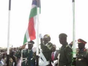 A Unity State official in Bentui raises the South Sudan flag today to mark independence from North Sudan. July 9, 2011 (ST)