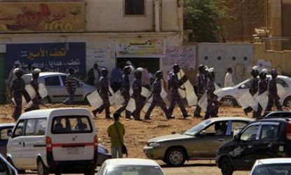 Sudanese anti-riot police members march to disperse anti-government protests in Khartoum in January (FILE)