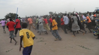 Abii supporters pouring onto the field after Ajang wins, Jonglei (ST)