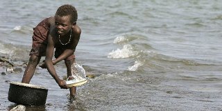 An El Molo boy fetching water in Lake Turkana (Reuters)