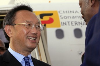 China's Foreign Minister Yang Jiechi is welcomed by a Sudanese official as he arrives for a two day visit to Sudan in Khartoum August 7, 2011 (Reuters)