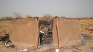 Remains of burnt houses in Bor County, February 2011. (Photo: John Actually/ST)