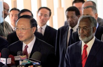 Chinese Foreign Minister Yang Jiechi speaks to the press as Sudanese Foreign Minister Ali Karti (R) listens on following their meeting in Khartoum on August 8, 2011 (AFP)