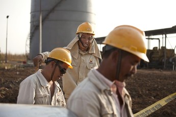 Workers for the China Petroleum Engineering & Construction Corp. construct new oil facilities near Melut, Sudan, in November 2010 (Trevor Snapp / Bloomberg)