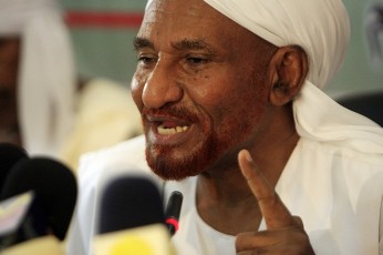 Al-Sadiq Al-Mahdi, leader of the opposition National Umma Party (NUP) and former prime minister, speaks during a news conference about the Doha Agreement on Darfur, in Khartoum August 13, 2011 (Reuters)