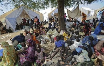 Residents gather outside the UNMIS sector headquarters after fleeing fighting in Kadugli, the capital of South Kordofan, Sudan, Thursday, June 9, 2011. (UNMIS)s)