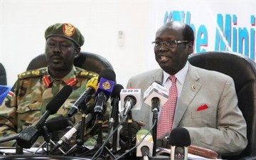 FILE - Southern army spokesman Colonel Philip Aguer, left, and information minister Barnaba Marial Benjamin, right, at a press conference in Juba, Southern Sudan Sunday, May 22, 2011 (AP)