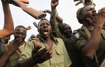 Soldiers from Sudan's army celebrate after gaining control of the area, at the Blue Nile state capital al-Damazin, September 5, 2011 (Reuters)