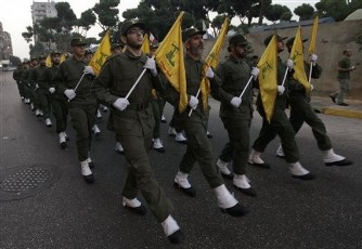 In this picture taken on November 12, 2010, Hezbollah fighters parade during the inauguration of a new cemetery for their fighters who died in fighting against Israel, at the southern suburb of Beirut, Lebanon (AP)