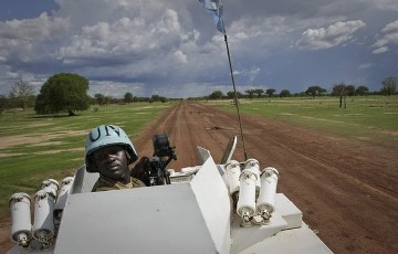 FILE - A gunner from Zambia serving with the international peacekeeping operation is seen on an armoured personel carrier (APC) during a patrol in the region of Abyei, central Sudan, in this handout picture released by the United Nations Mission in Sudan (UNMIS) May 30, 2011 (Reuters)