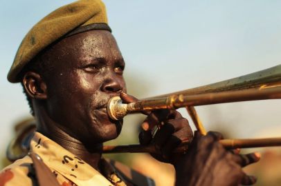 A member of a branch of the SPLA plays a trombone in a pro-independence march on 5 January 2011 in Juba, Sudan (Getty)
