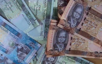 A picture shows freshly-minted notes of the new South Sudan pound, which pictures the late South Sudanese independence leader John Garang, in Juba on July 18, 2011.(Getty)