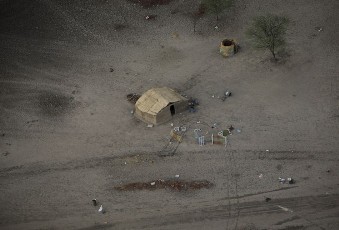 FILE - A aerial view of looted items scattered on the ground in front of a deserted homestead on the outskirts of Abyei town (Reuters)