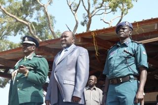 Lakes state governor Chol Tong Mayay (center), Acieu Tito the head of police in South Sudan (left) and Lakes state commissioner of police Saed Chawuol Lom (right) at graduation ceremony for police in Rumbek. October 4, 2011 (ST)