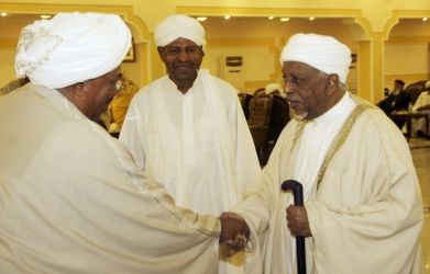 President Omar Hassan al-Bashir (L) is greeted by Mohamed Osman Al-Mirghani, leader of DUP during Eid al-Fitr celebrations in Khartoum August 30, 2011- (Reuters)
